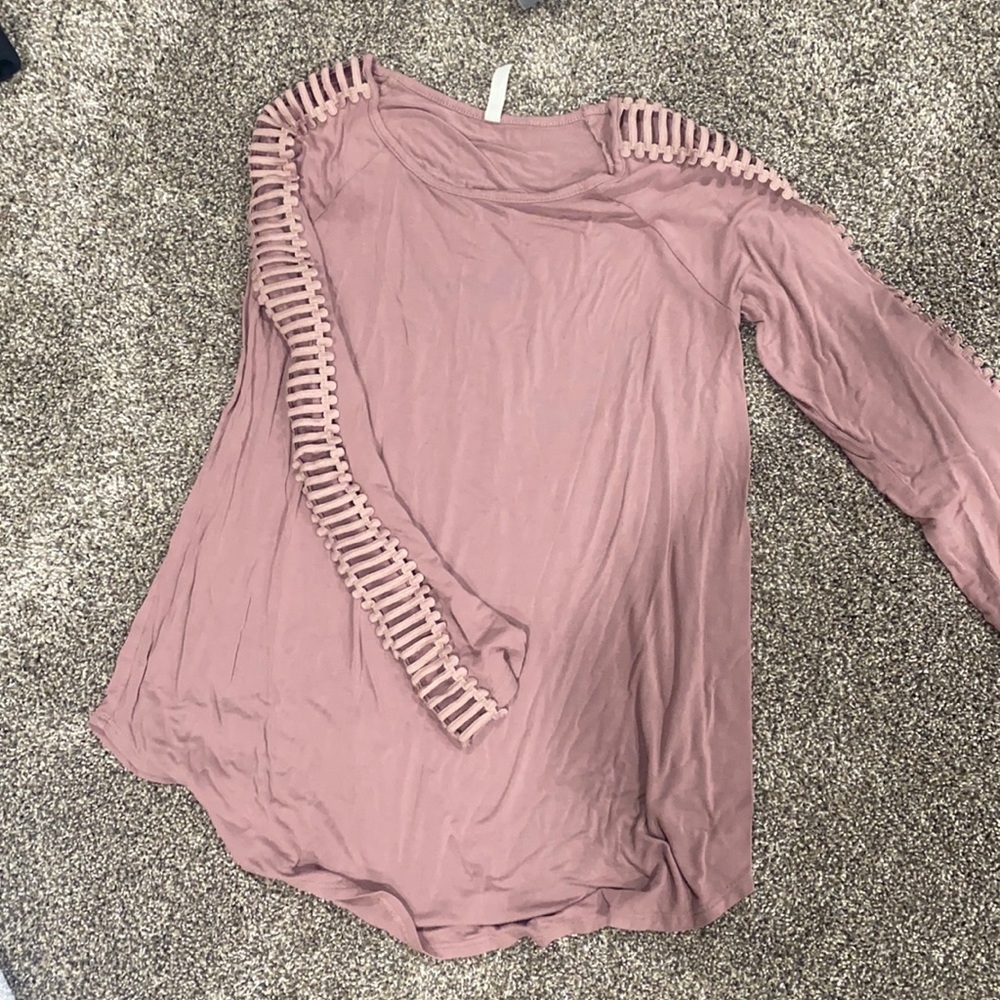 Light pink shirt with slits down arms